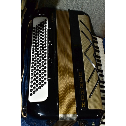 495 - A CASED HOHNER VIRTUOLA III 'PIANO ACCORDION', in black finish with 120 bass and 5 treble couplers a... 