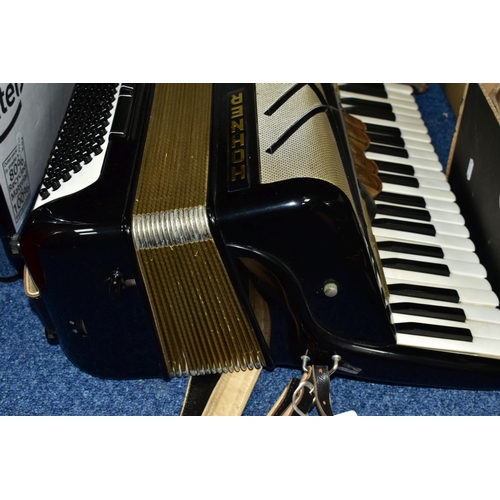 495 - A CASED HOHNER VIRTUOLA III 'PIANO ACCORDION', in black finish with 120 bass and 5 treble couplers a... 