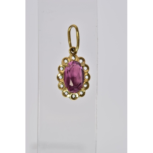 55 - A 9CT GOLD GARNET PENDANT AND FOUR OTHER YELLOW METAL PENDANTS, the first set with a pear cut garnet... 