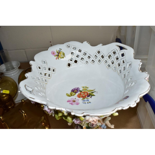 611 - A CONTINENTAL TABLE CENTRE PIECE, having pierced basket bowl decorated with roses, standing on a ped... 