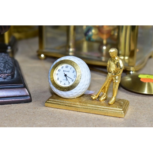 612 - A GROUP OF FIVE QUARTZ CLOCKS WITH ONE OIL LAMP, including two novelty golfing interest clocks, (Jul... 