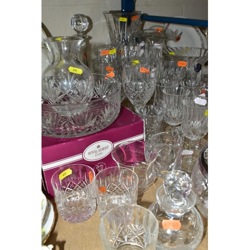 619 - A GROUP OF GLASSWARE AND CUT GLASS, including  four Stuart crystal champagne flutes, three matching ... 