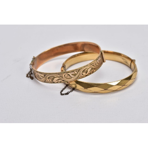 66 - TWO ROLLED GOLD HINGED BANGLES, one with an engraved floral design, the other with a textured design... 