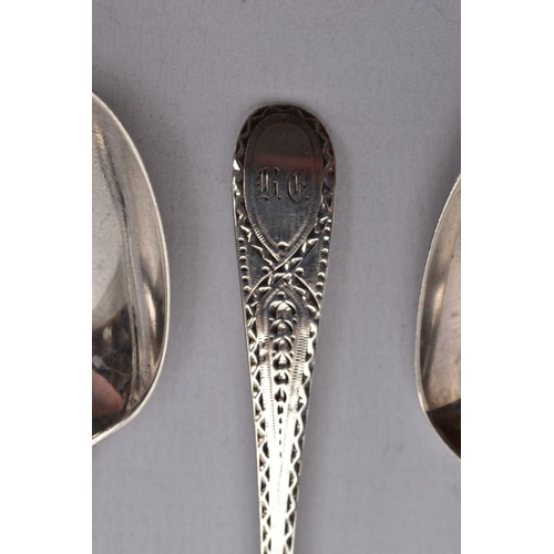 71 - SEVEN SILVER TEASPOONS, four Georgian spoons with an engraved design to the handles and an engraved ... 