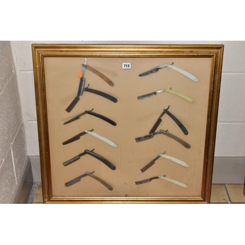 712 - A FRAMED DISPLAY OF TWELVE STRAIGHT/CUT THROAT RAZORS, gilt framed, size of frame approximately 69cm... 