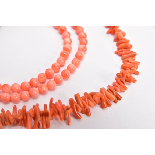 8 - TWO CORAL NECKLACES, the first a polished pink coral bead necklace, each bead measuring approximatel... 