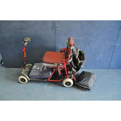 1051 - A PRO RIDER TE-FS4 FOLDING DISABILITY SCOOTER with charger and rain cover