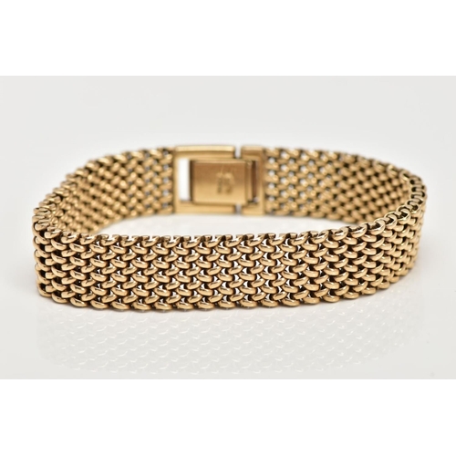15 - A 9CT GOLD HEAVY MESH BRACELET, approximate width 12.7mm, fitted with a fold over clasp, hallmarked ... 