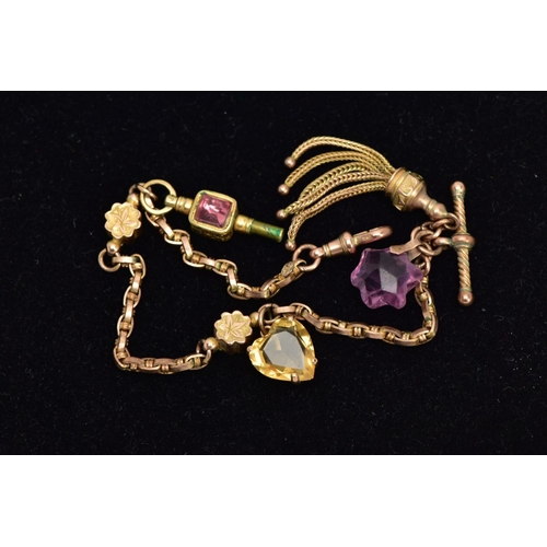 18 - A YELLOW METAL ALBERTINA WITH CHARMS, fancy link chain fitted with two foliate engraved links, suspe... 