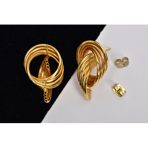 27 - A PAIR OF 9CT GOLD HOOP EARRINGS, each designed with three intertwined gold wires, post and scroll f... 