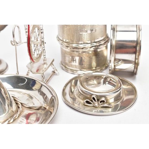 106 - A COLLECTION OF SILVER AND WHITE METAL ITEMS, to include four hallmarked silver napkin rings, two of... 