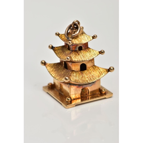 115 - A CHINESE PAGODA CHARM, height 25mm, approximate gross weight 5 grams (Condition report: slight tarn... 