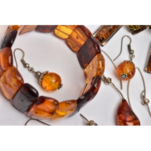120 - A SELECTION OF MAINLY CLARIFIED AMBER JEWELLERY, including an elasticated panel bracelet, a pair of ... 