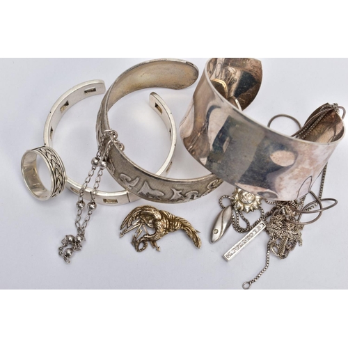 125 - A SELECTION OF SILVER AND WHITE METAL JEWELLERY, to include three torque bangles, a rope twist desig... 