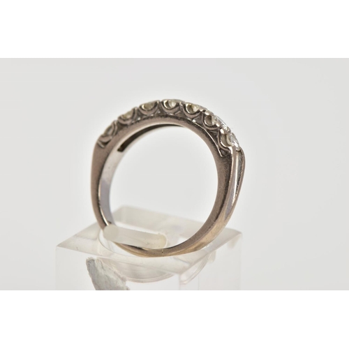 13 - A WHITE METAL DIAMOND HALF ETERNITY RING, designed with a row of claw set round brilliant cut diamon... 
