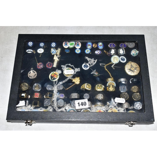 140 - A JEWELLERY BOX OF MASONIC COSTUME JEWELLERY, to include signet rings, cufflinks, money clip, stick ... 