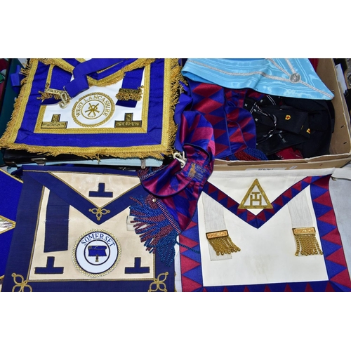 141 - A LARGE QUANTITY OF MASONIC BOOKS AND REGALIA, to include a number of aprons in two suitcases and a ... 