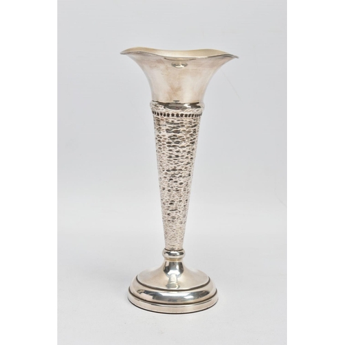 144 - A SILVER STEM VASE, of conical form with hammered detail, flared undulating rim and a weighted base,... 