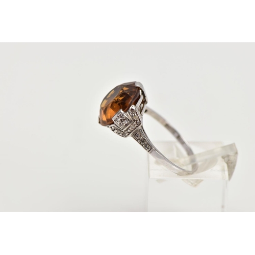 154 - A LATE VICTORIAN CITRINE AND DIAMOND RING, a round faceted citrine measuring approximately 12.3mm in... 