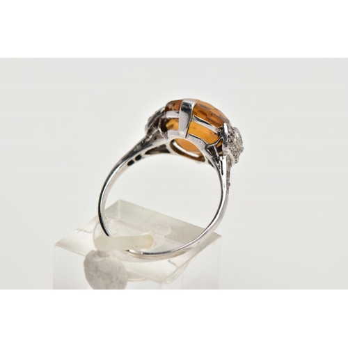 154 - A LATE VICTORIAN CITRINE AND DIAMOND RING, a round faceted citrine measuring approximately 12.3mm in... 