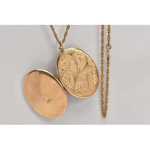 158 - A 9CT OVAL LOCKET AND CHAIN, an oval locket with scroll engraving measuring approximately 40.0mm x 3... 