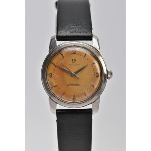 25 - A HAND WOUND OMEGA SEAMASTER WRISTWATCH, discoloured dial with Arabic markers quarterly and pointed ... 