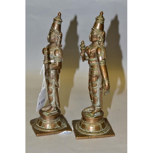 309 - A NEAR PAIR OF BRONZE FIGURES OF PARVATI HOLDING A LOTUS FLOWER, cast on a circular plinth with squa... 