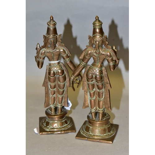 309 - A NEAR PAIR OF BRONZE FIGURES OF PARVATI HOLDING A LOTUS FLOWER, cast on a circular plinth with squa... 