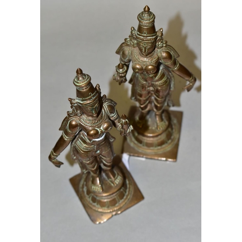 309 - A NEAR PAIR OF BRONZE FIGURES OF PARVATI HOLDING A LOTUS FLOWER, cast on a circular plinth with squa... 