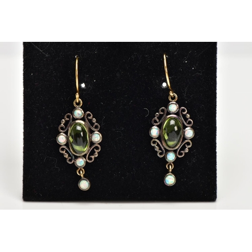 35 - A PAIR OF PERIDOT AND OPAL DROP EARRINGS, the central oval peridot cabochon with four circular colle... 