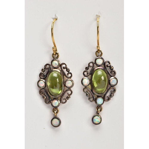35 - A PAIR OF PERIDOT AND OPAL DROP EARRINGS, the central oval peridot cabochon with four circular colle... 
