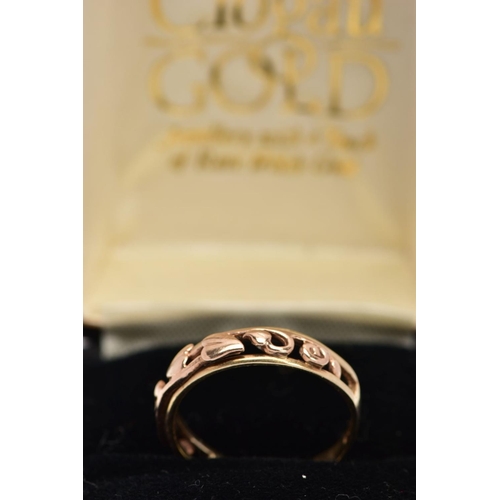 52 - A 9CT GOLD CLOGAU RING, the tapered band with openwork 'Tree of Life,' design to the front half band... 