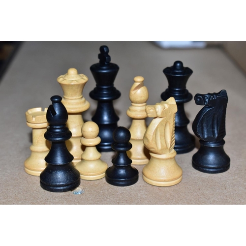 538 - A WOODEN CHESS BOARD AND A QUANTITY OF WOODEN AND RESIN CHESS SETS, including two resin sets formed ... 