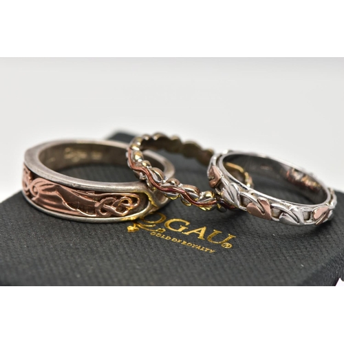 54 - THREE SILVER CLOGAU RINGS, the first a tapered silver band with applied 'Dragon Wing' rose gold desi... 