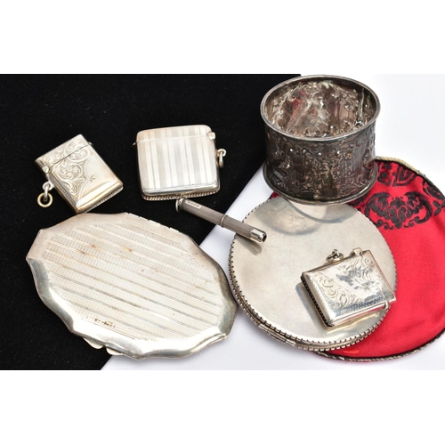 62 - SEVEN SILVER AND WHITE METAL ACCESSORIES, to include three early 20th century silver vesta cases, a ... 