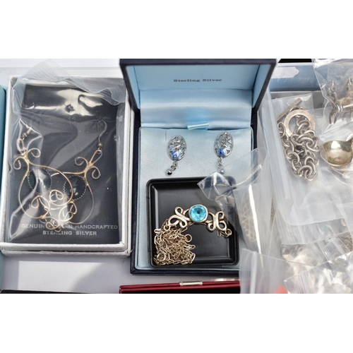 81 - A SELECTION OF SILVER AND WHITE METAL JEWELLERY, to include various earrings, various charms, a rose... 