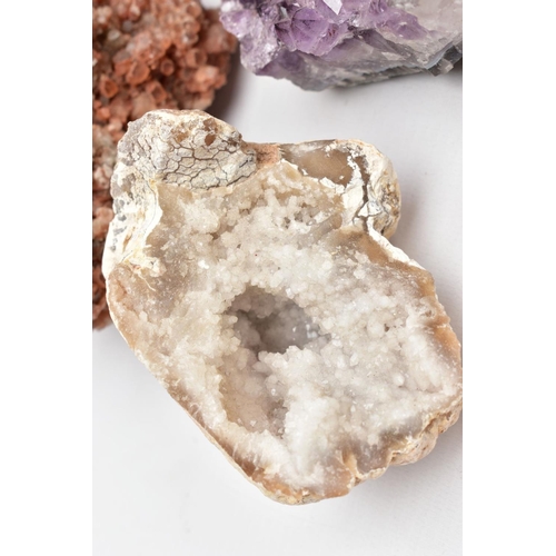 82 - A COLLECTION OF GEM CRYSTALS, to include two quartz geodes, a collection of amethyst crystals and a ... 
