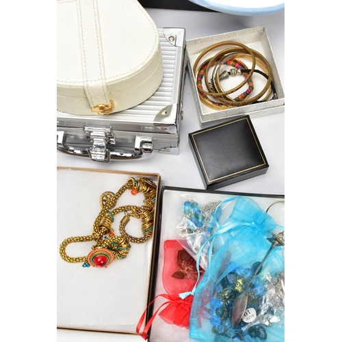 83 - A BOX OF COSTUME JEWELLERY, to include two enamel brooches by Fish, a hinged bangle, various brooche... 