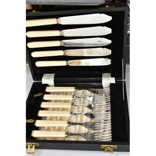 85 - TWO LARGE BOXES OF STAINLESS STEEL AND SILVER-PLATED CUTLERY, all of various designs mixed, some kni... 