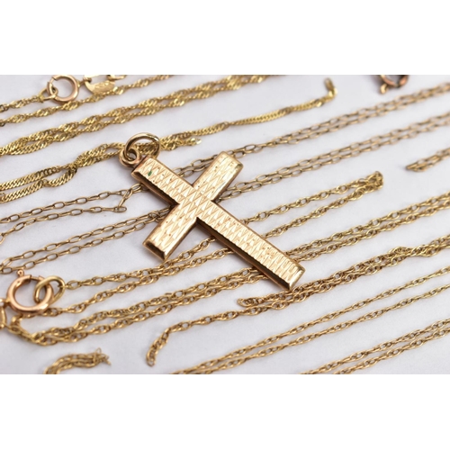 9 - A 9CT GOLD CROSS PENDANT AND FOUR BROKEN YELLOW METAL CHAINS, the textured cross pendant, hallmarked... 