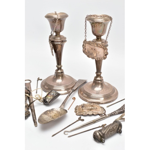 96 - A SELECTION OF SILVER ITEMS, to include a pair of candlesticks, plain design with banding at each se... 