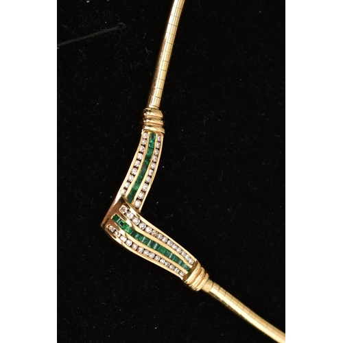 12 - AN EMERALD AND DIAMOND COLLAR NECKLACE, the V-shape central panel channel set with a central line of... 