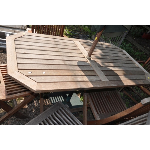 1003 - A MODERN HARDWOOD FOLDING GARDEN TABLE 150cm long 80cm deep, six folding chairs including two carver... 