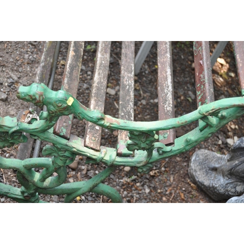 1019 - A VICTORIAN COALBROOKDALE STYLE CAST IRON GARDEN BENCH with foliate detail to arms terminating with ... 