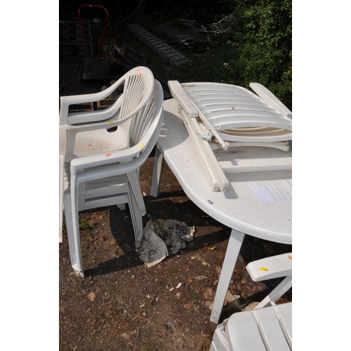 1029 - A WHITE PLASTIC GARDEN TABLE 140cm long , three chairs and a pair of loungers (6)