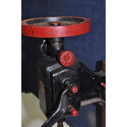 1065 - A VINTAGE IXION MANUAL DRILL PRESS overpainted in black and red paint in working order ( split to ha... 