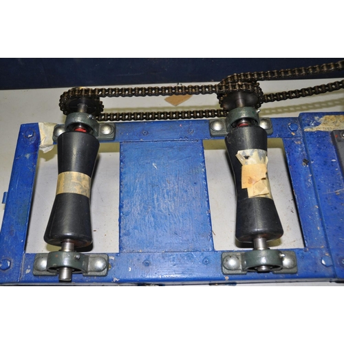 1086 - A METAL FRAME CONTAINING TWO INWARD TAPERING ROLLERS 32cm centres, connected together by chain and t... 