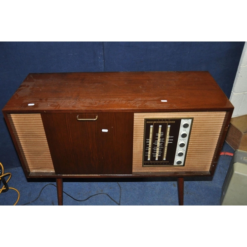 1121 - AN EKCO SRG 412 VINTAGE VALVE STEREOGRAM  in walnut case, tapered legs and Garrard SP25Mk5 turntable... 