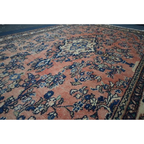 1200 - A WOOLLEN KASHAN RUG, red and cream ground, with a multi strap border, 316cm x 213cm