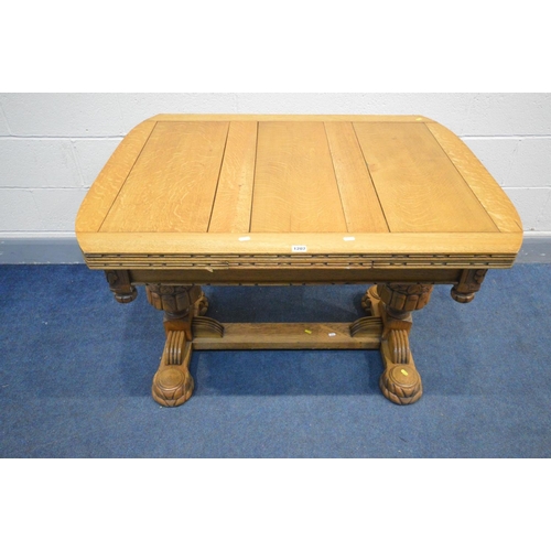 1207 - AN ART DECO LIGHT OAK DRAW LEAF TABLE, rose carving to each frieze corner, united by a H stretcher o... 